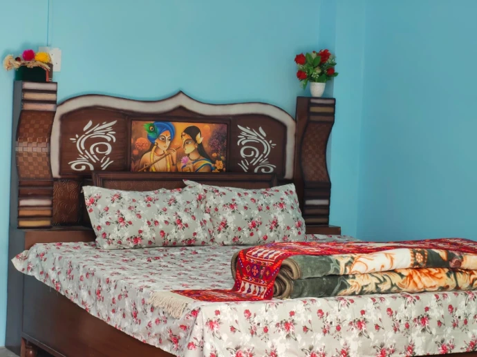 Comfortable bedroom with traditional decor at The Homgarang Abode