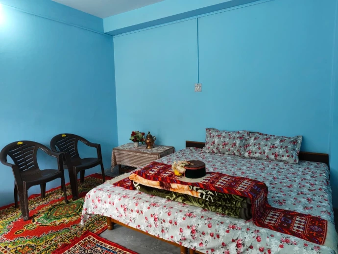 Cozy bedroom with traditional decor at The Homgarang Abode